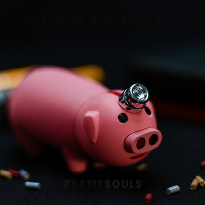 Close-up of pig-shaped lighter with FlameSouls logo